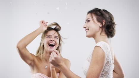 two bridesmaids having fun at a wedding