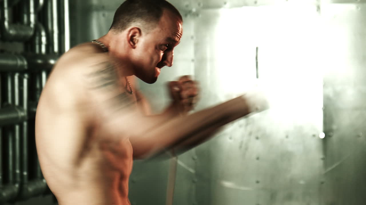 Man Boxing Workout in Industrial Setting