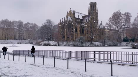 Johanneskirche-at-Feuersee-covered-in-snow-during-winter-in-Stuttgart,-Germany