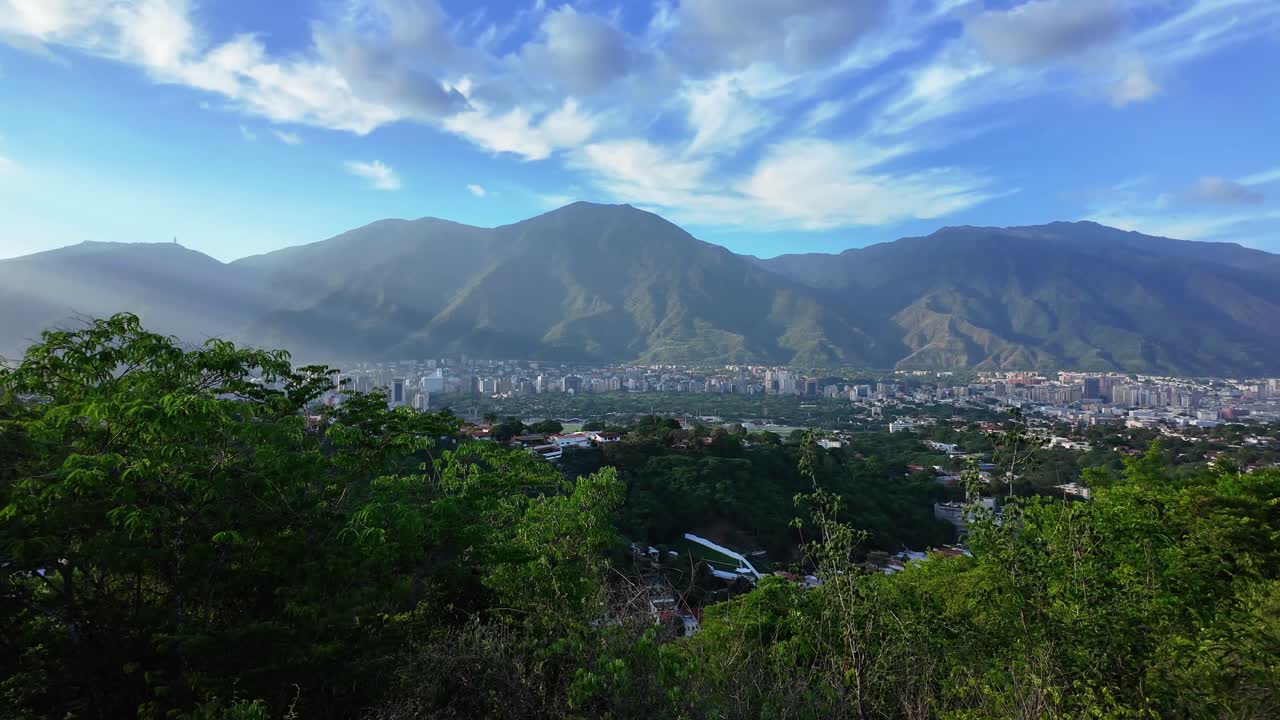 South American cityscape: Caracas city nestled below lush green mountains
