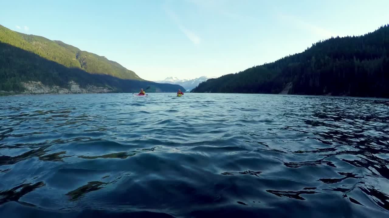 Tourist rowing a boat in the river 4k