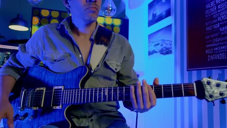 Close-Up-Shot-Of-Musician-Playing-Guitar-Happily-In-Pub