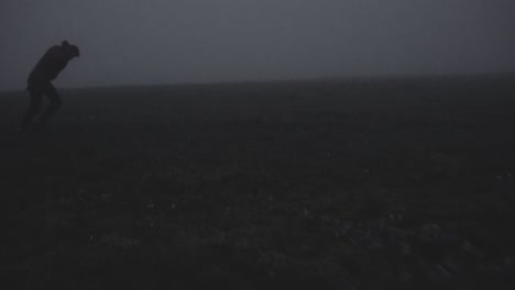 silhouette in abandoned icelandic canyon in a foggy, moody, dramatic landscape