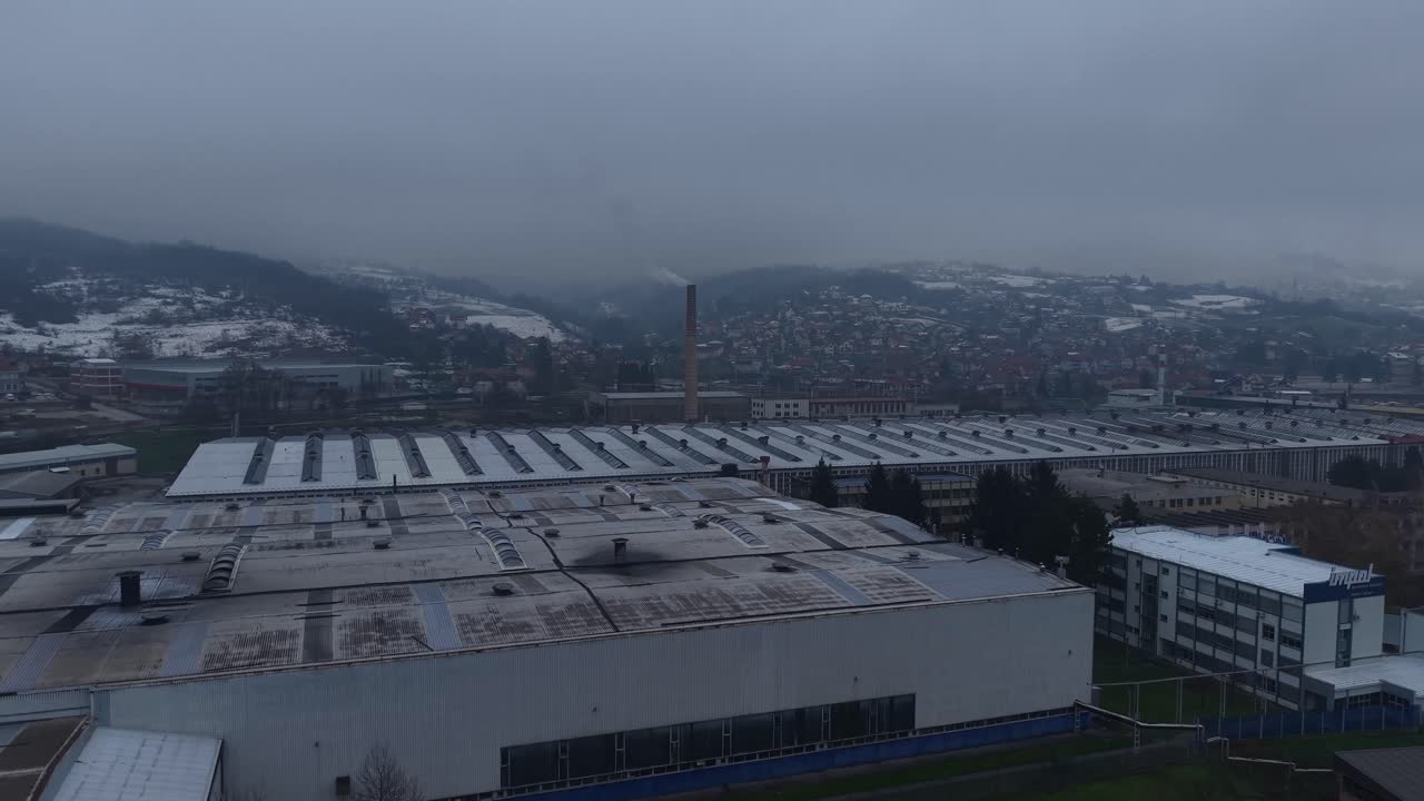 Drone Shot of Smoke From Factory in Small Industrial City on Dark Autumn Day