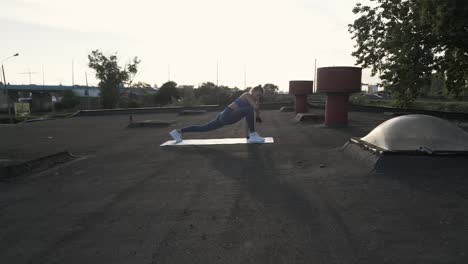 Tracking-shot-towards-a-fit-woman-doing-stretches