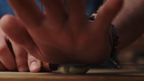 static video of crushing garlic with a kitchen knife