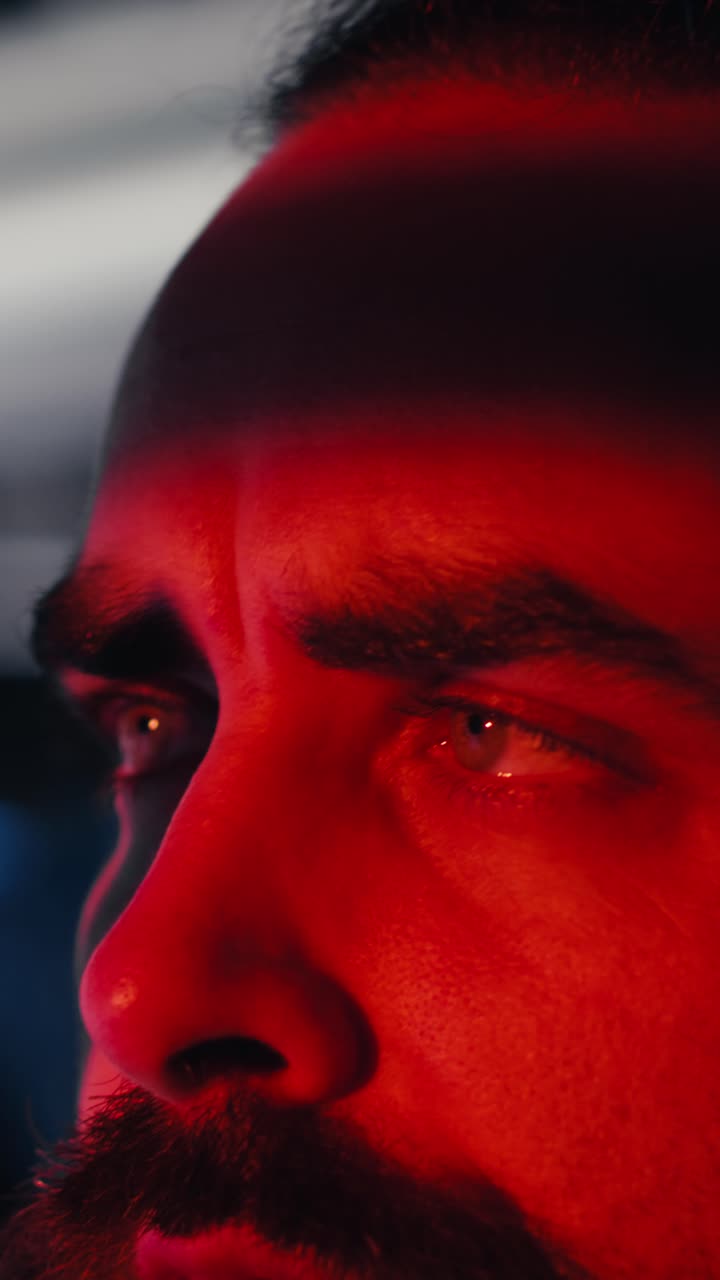 Vertical video Portrait of joyous cosmonaut putting helmet on, preparing for mission launh