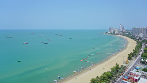 Traffic-both-on-land-and-sea-is-captured-in-a-timelapse-of-shoreline-and-highway-in-Pattaya-city-Thailand