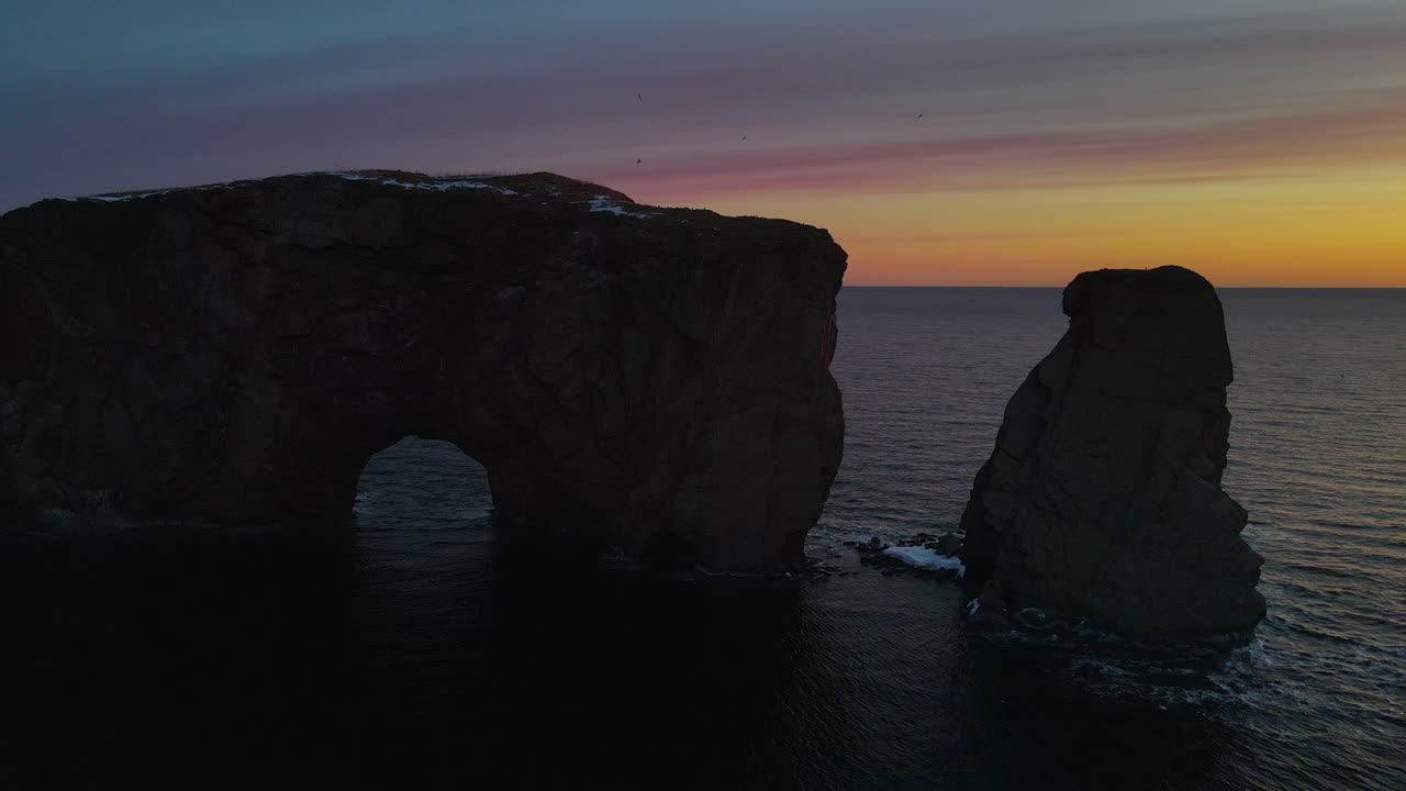 Drone view at sunrise of famous perce rock in Percé, Québec, Canada