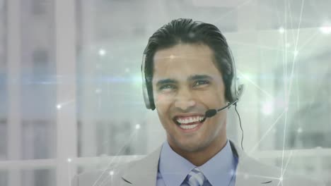 Animation-of-network-of-connections-over-businessman-using-phone-headset