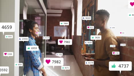 animation of media icons over diverse colleagues discussing work