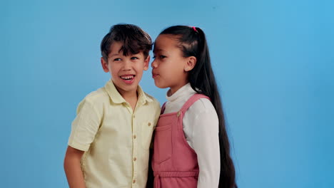 two children whispering secrets