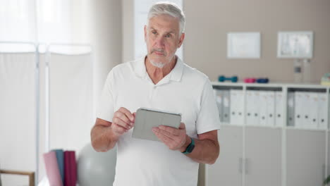 man holding a tablet in a physiotherapy clinic