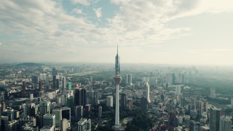 kuala lumpur telecommunication tower and mega tall skyscraper merdeka 118, old downtown, panoramic drone view