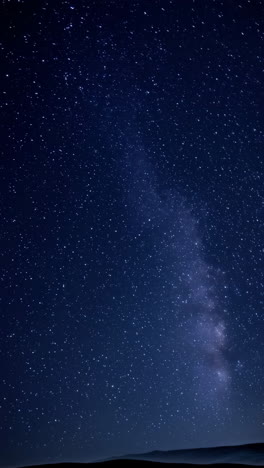 vast starry night sky over silhouetted landscape