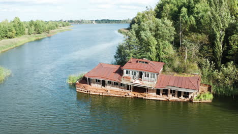 half-sunk houseboat, abandoned after the chernobyl nuclear disaster in 1986