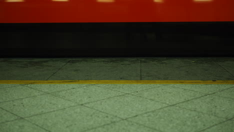 Ground-shot-of-subway-platform-with-arriving-train