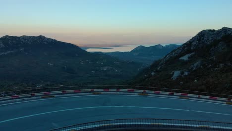 Aerial-medium-shot-of-mountain-road-after-sunset-7