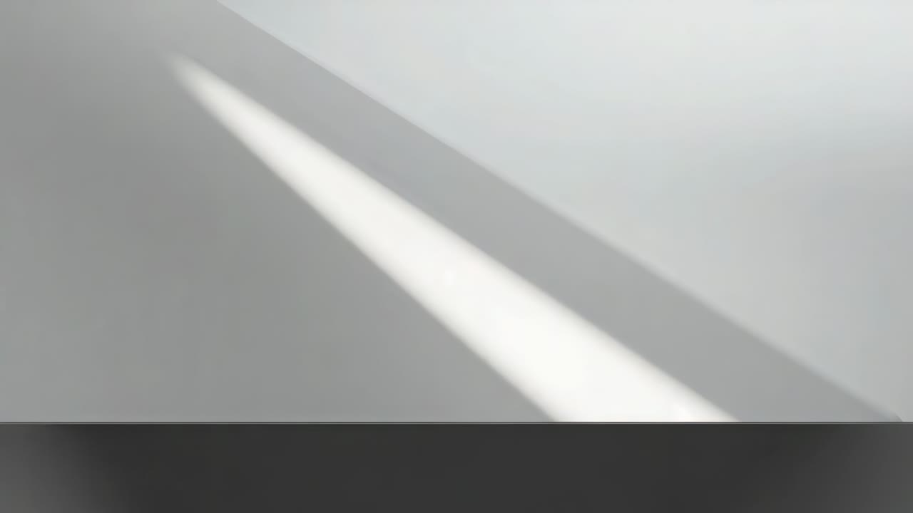 Shifting beam from sunlight passing slit, sliding across pale wall with shadow and dark trim