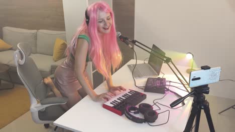 woman recording music in home studio