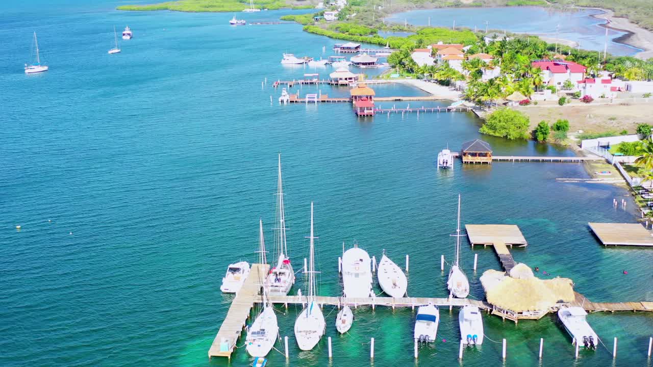 Drone pov of boats moored at Las Calderas Bani harbor, Dominican Republic