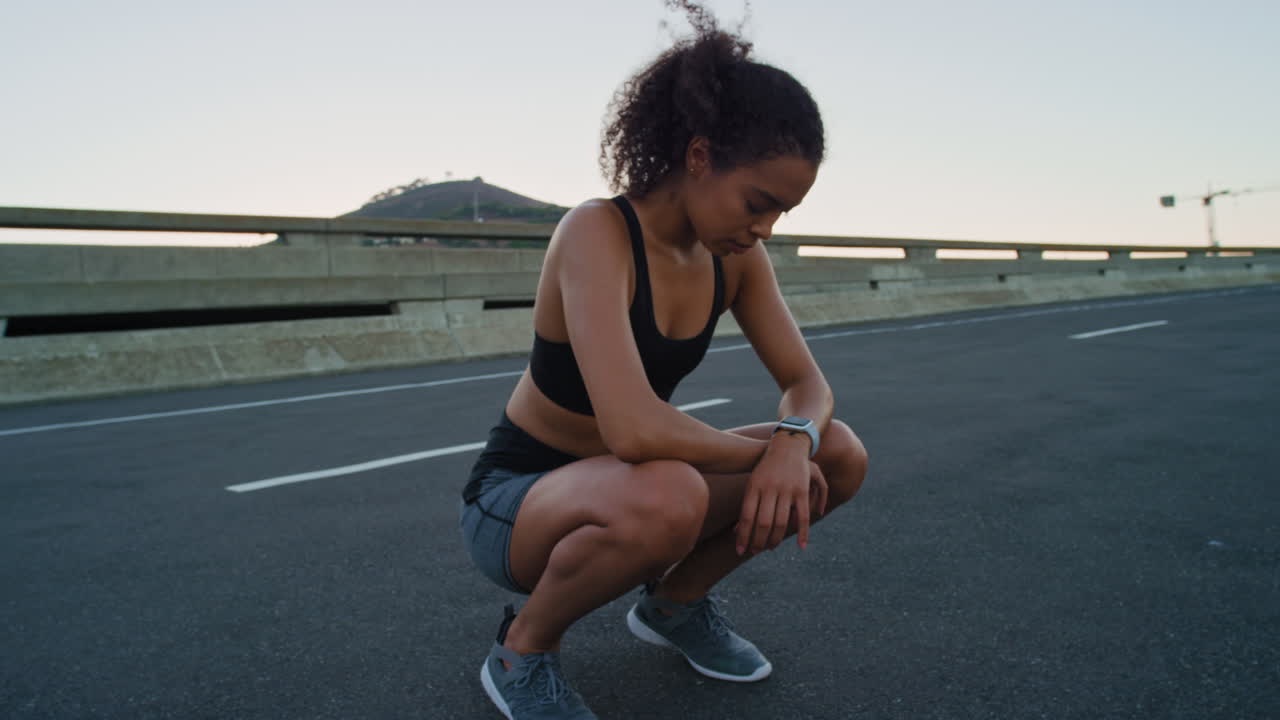 Black woman, fitness rest and runner on city road