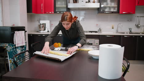 young woman cook prepares typical prato sweets in tuscany cantucci
