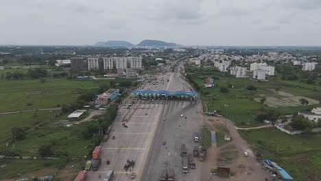 aerial view of a busy toll plaza on a highway in india