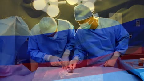 Animation-of-flag-of-colombia-waving-over-surgeons-in-operating-theatre