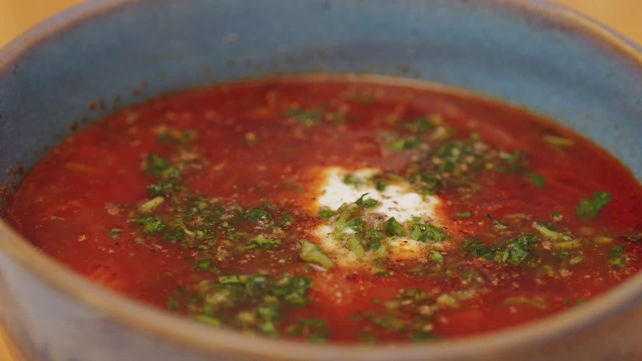 Beetroot soup, Cooking traditional national Russian, Ukranian soup Borsch close-up. Boiling red soup with vegetables and turkey meat and spices. Special red for Borsh from beet, tomatoes pasta