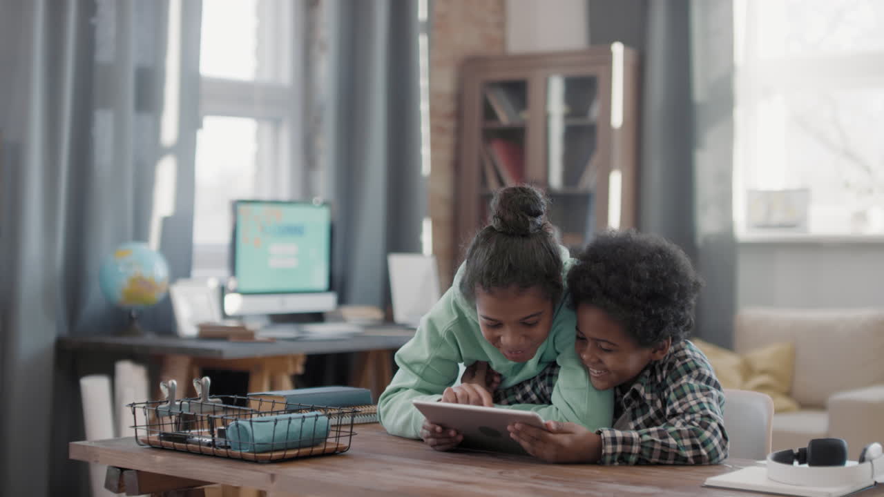 Afro Kids Playing Games On Tablet