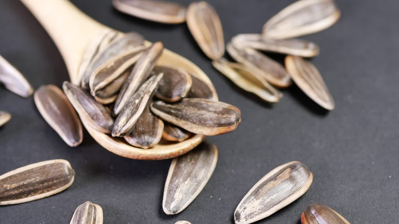 Close-up of Sunflower Seeds on a Wooden Spoon