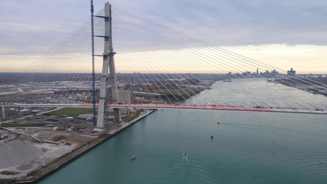 Sunset over Gordie Howe Bridge with Detroit skyline in background