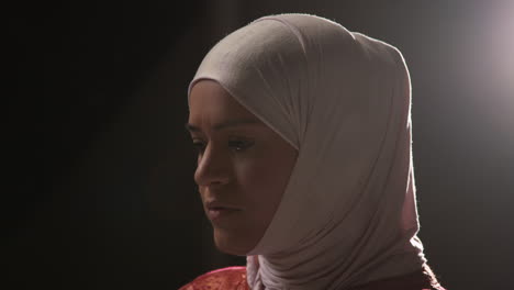 studio portrait of muslim woman wearing hijab against plain background 3