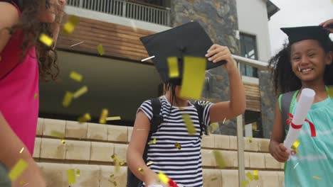 animation of gold confetti over celebrating diverse schoolgirls with mortar boards and diplomas