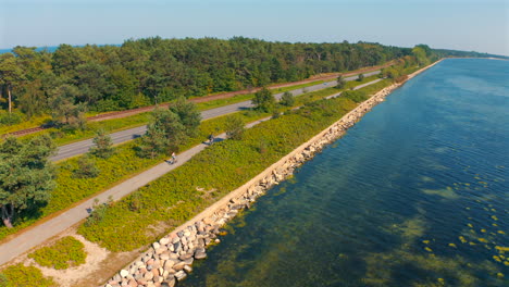 cycling on the biking lane near the baltic sea towards chalupy, poland