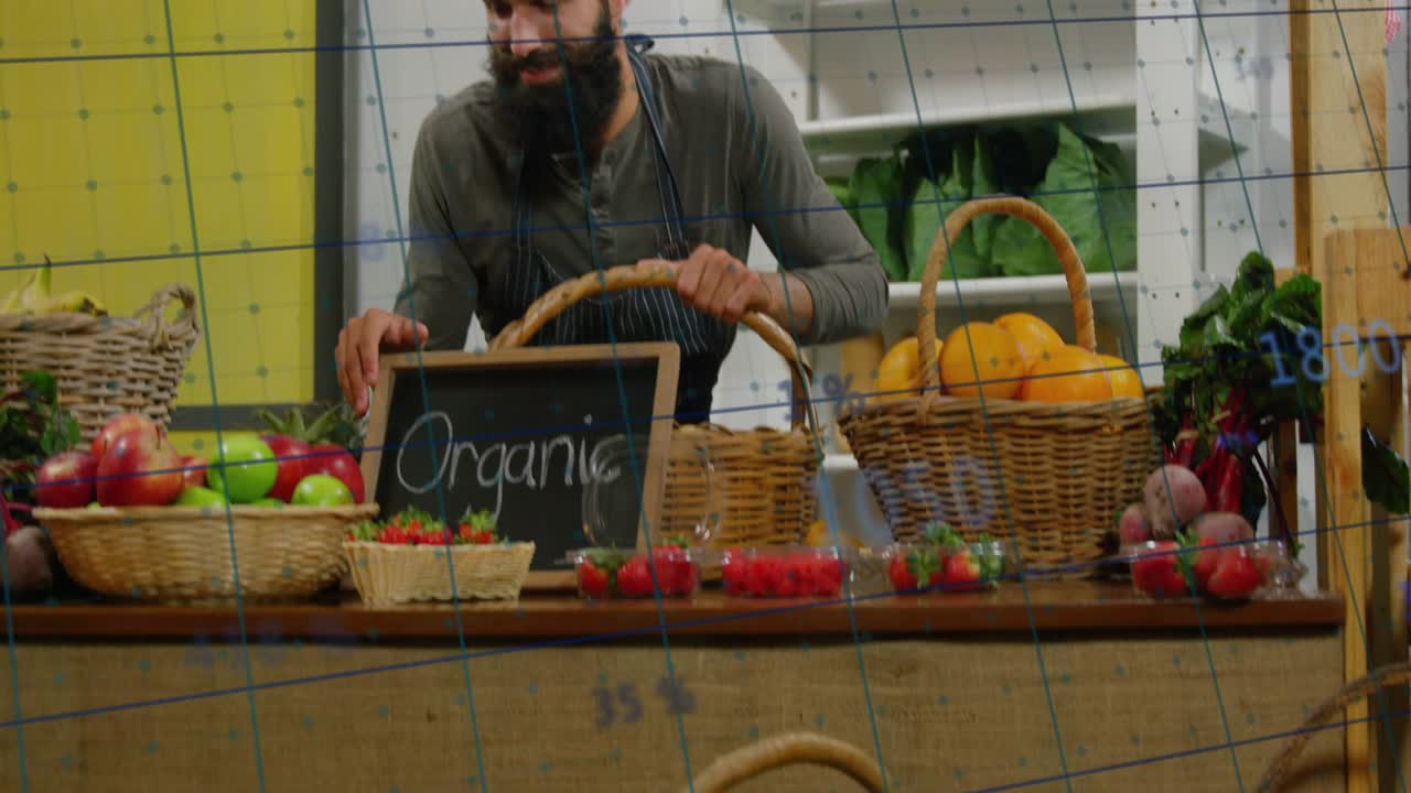 Market vendor leaning forward holding basket presenting organic goods as graphs moving across stall
