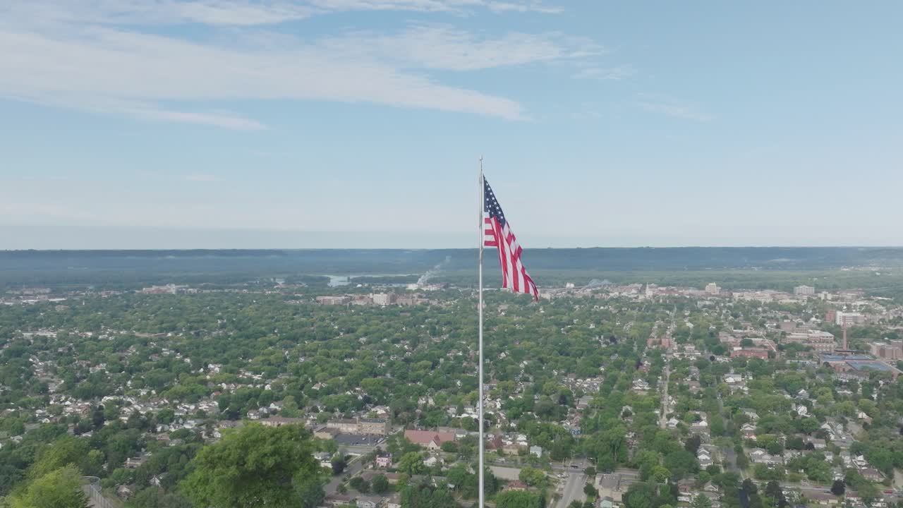 Aerial view of Grandad Bluff overlooking the city of La Crosse, the Mississippi River Valley in USA with American flag waving high.