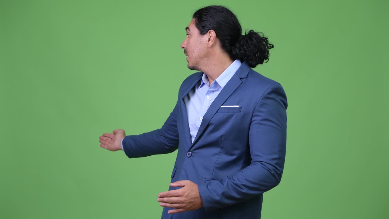 Handsome businessman presenting something