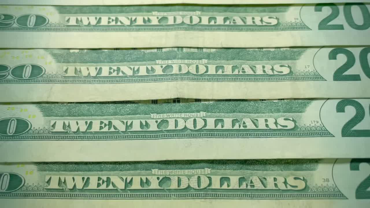 20달러 지폐는 "백악관"이라는 텍스트에 초점을 맞추고 천천히 확대됩니다.