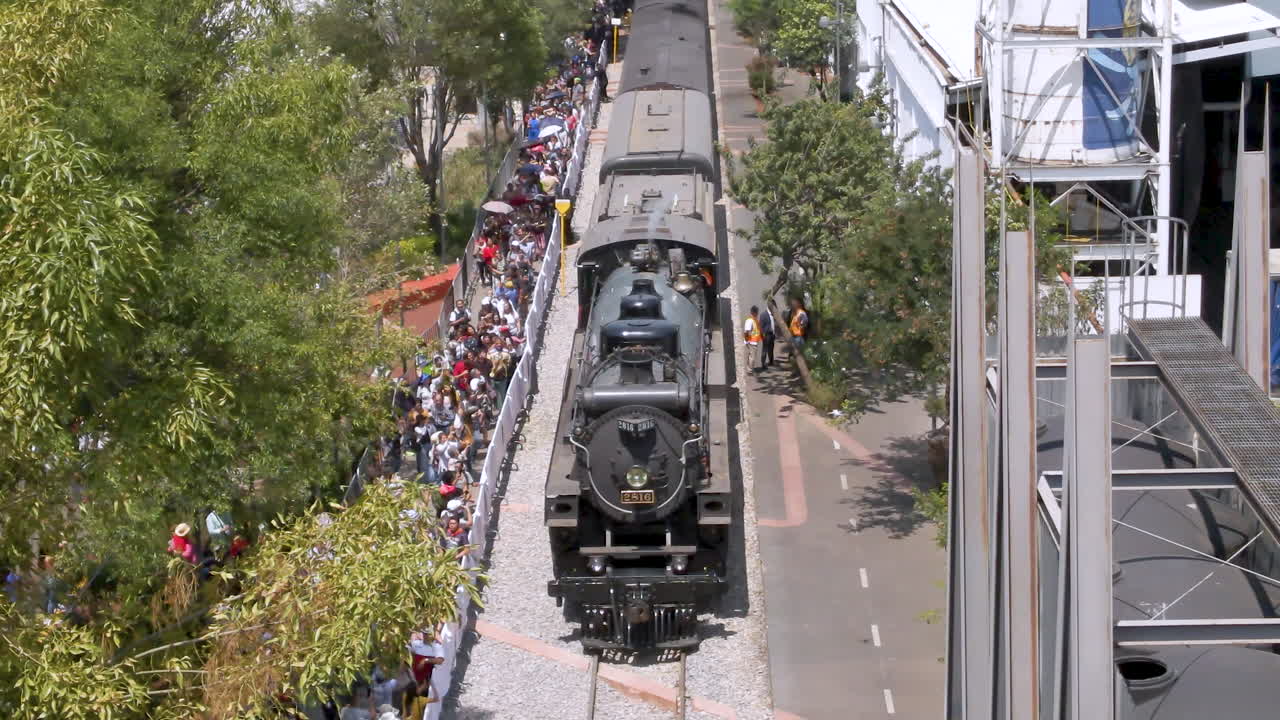Steam Train and Crowds at Railway Station
