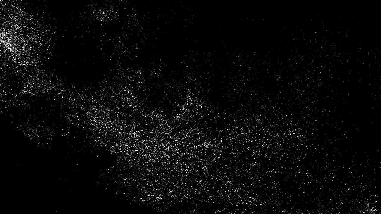 Particelle di polvere bianca astratta in movimento su sfondo nero
