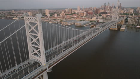 establishing shot of philadelphia's ben franklin bridge. shot at sunrise in pennsylvania
