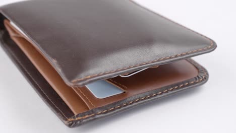 Close-up-of-the-rotation-Beautiful-male-Brown-leather-wallet