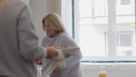 happy family preparing dishes for festive celebration at home family party