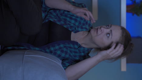 Vertical-video-of-Woman-having-a-nervous-breakdown-at-home-at-night.