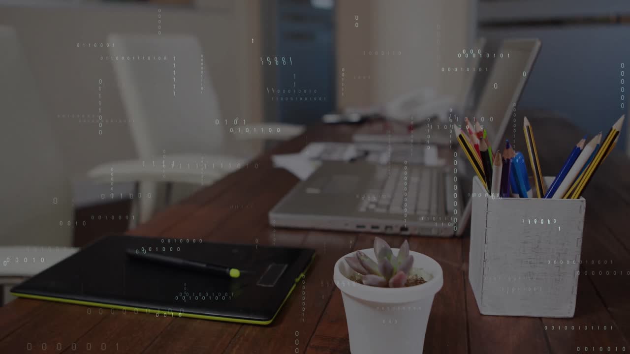 Animation of binary coding data processing against close up of equipment on office desk