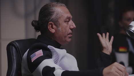 man in space suit discussing flight