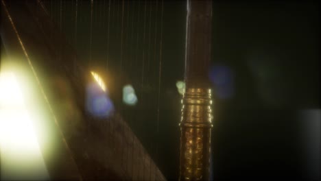 harp instrument in dark with bright lights