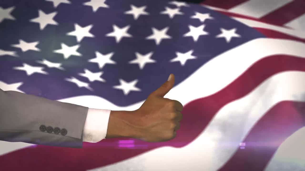American flag blowing with thumbs up